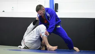 Two Brazilian Jiu Jitsu practitioners engaging